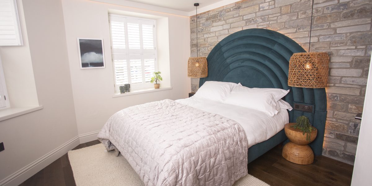 Luxury bedroom overlooking the Cardigan Bay coastline at boutique hotel in Wales