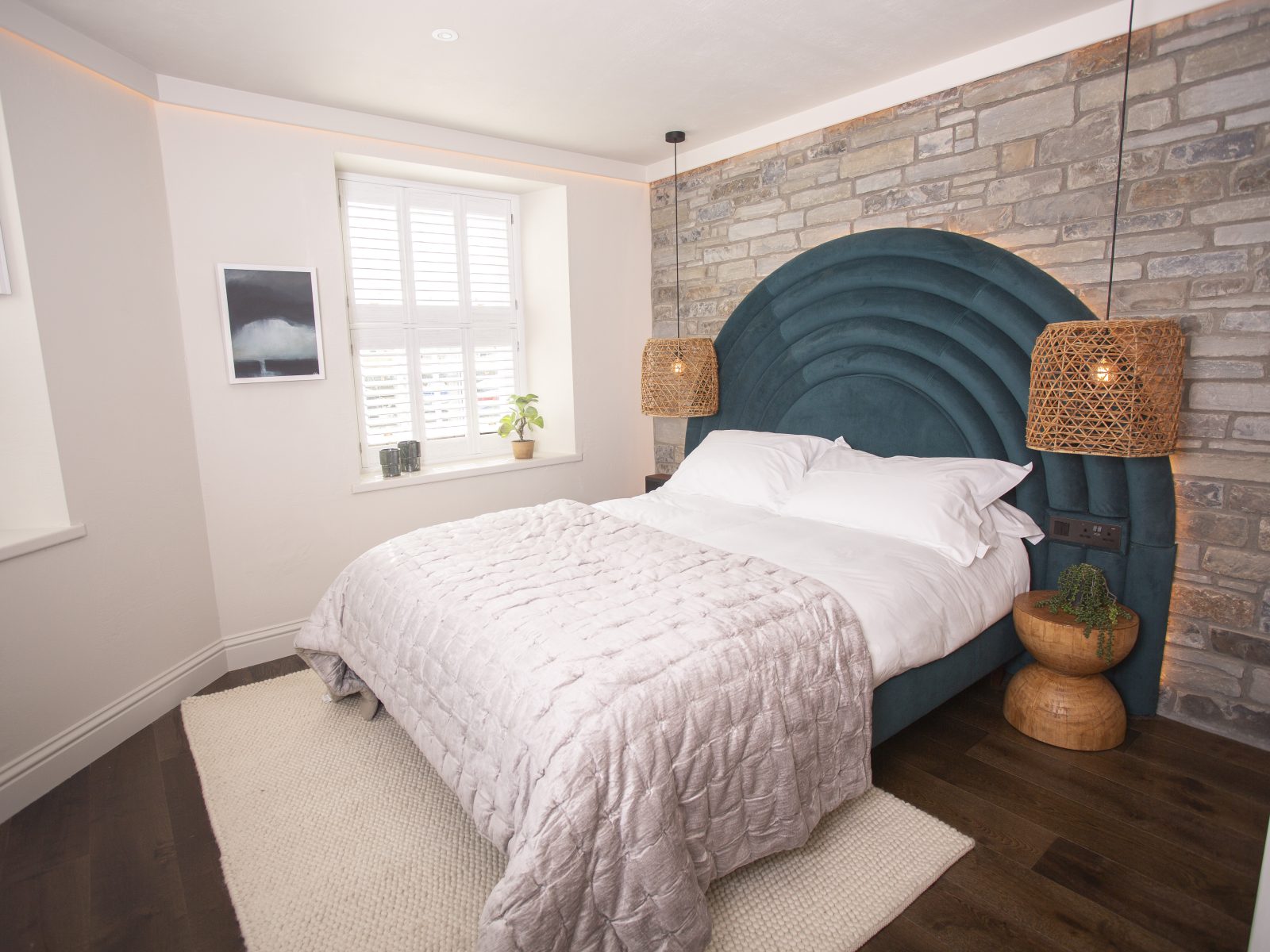 Luxury bedroom overlooking the Cardigan Bay coastline at boutique hotel in Wales